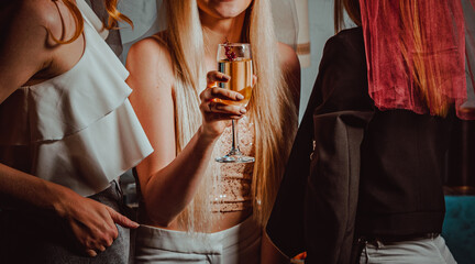 Women hand with glass of champagne wine