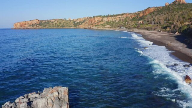 Bright spring view of Torre Conca beach. Superb seascape of Mediterranean sea. Wonderful outdoor scene of Sicily, Italy, Europe. 4k drone forward video (Ultra High Definition).