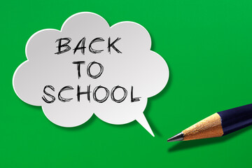 Back to school concept, speech bubble with pencil on green background