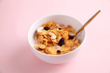 Cereal dessert with corn oat and dry fruits isolated in pink background