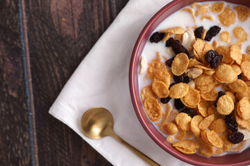 Cereal dessert with corn oat and dry fruits isolated in wood background