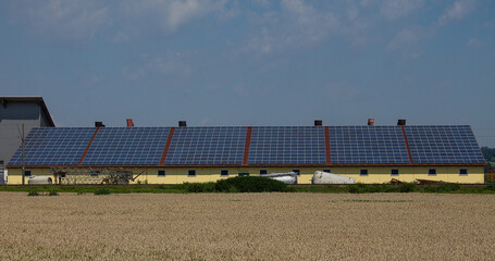 A very large photovoltaic system on an agricultural building. With six large units.