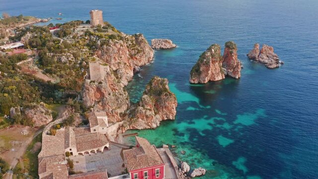 Picturesque spring scene of Tonnara di Scopello. Colorful view of Sicily, Italy, Europe. Wonderful morning seascape of Mediterranean sea. 4k drone forward video (Ultra High Definition).
