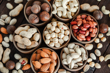 Assorted nuts for a background
Almond, walnut,cashew, pistachios, hazelnuts, peanuts, Macadamia
Collection of different varieties of nuts. Composition with dried fruits
Healthy food. Organic.
