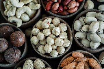 Assorted nuts for a background
Almond, walnut,cashew, pistachios, hazelnuts, peanuts, Macadamia
Collection of different varieties of nuts. Composition with dried fruits
Healthy food. Organic.