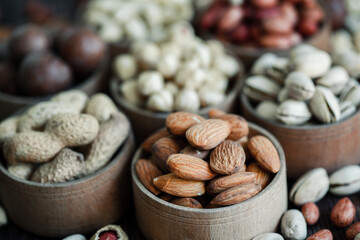 Assorted nuts for a background
Almond, walnut,cashew, pistachios, hazelnuts, peanuts, Macadamia
Collection of different varieties of nuts. Composition with dried fruits
Healthy food. Organic.
