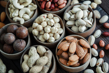 Assorted nuts for a background
Almond, walnut,cashew, pistachios, hazelnuts, peanuts, Macadamia
Collection of different varieties of nuts. Composition with dried fruits
Healthy food. Organic.