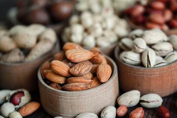 Assorted nuts for a background
Almond, walnut,cashew, pistachios, hazelnuts, peanuts, Macadamia
Collection of different varieties of nuts. Composition with dried fruits
Healthy food. Organic.