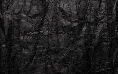 Black crumpled paper texture, grunge background