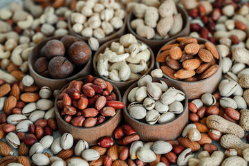 Assorted nuts for a background
Almond, walnut,cashew, pistachios, hazelnuts, peanuts, Macadamia
Collection of different varieties of nuts. Composition with dried fruits
Healthy food. Organic.
