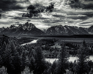 The teton range with the snake river in black and white.