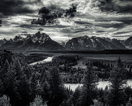 The teton range with the snake river in black and white.
