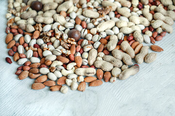 Assorted nuts for a background
Almond, walnut,cashew, pistachios, hazelnuts, peanuts, Macadamia
Collection of different varieties of nuts. Composition with dried fruits
Healthy food. Organic.