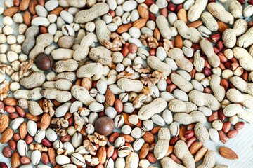 Assorted nuts for a background
Almond, walnut,cashew, pistachios, hazelnuts, peanuts, Macadamia
Collection of different varieties of nuts. Composition with dried fruits
Healthy food. Organic.