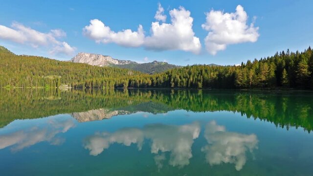 Morning view of Black Lake/Crno Jezero. Summer scene of Durmitor Nacionalni Park, Zabljak location, Montenegro, Europe. Beauty of nature concept background. Full HD video (High Definition).