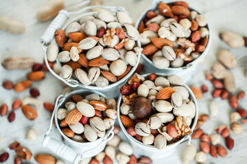Assorted nuts for a background
Almond, walnut,cashew, pistachios, hazelnuts, peanuts, Macadamia
Collection of different varieties of nuts. Composition with dried fruits
Healthy food. Organic.