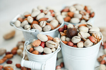 Assorted nuts for a background
Almond, walnut,cashew, pistachios, hazelnuts, peanuts, Macadamia
Collection of different varieties of nuts. Composition with dried fruits
Healthy food. Organic.