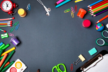 School supplies, office supplies on a black background. Flat lay style