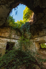 Abandoned church in ruins of Hermits Monks. Convent building from Portugal with tree growing inside.