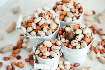 Assorted nuts for a background
Almond, walnut,cashew, pistachios, hazelnuts, peanuts, Macadamia
Collection of different varieties of nuts. Composition with dried fruits
Healthy food. Organic.