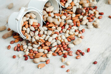 Assorted nuts for a background
Almond, walnut,cashew, pistachios, hazelnuts, peanuts, Macadamia
Collection of different varieties of nuts. Composition with dried fruits
Healthy food. Organic.