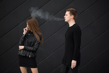 Passive smoking concept. Woman is covering her face from cigarette smoke