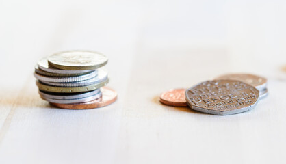A pile of coins against a light background