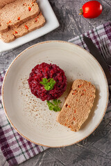 Fresh chicken terrine with beetroot confiture and parsley on a platter
