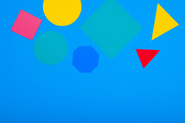 multicolored geometric shapes on a blue background