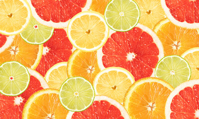 Bright banner with slices of citrus fruits - lemon, lime, orange and grapefruit. Advertising.