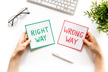 Making desicion concept. Right and wrong way icons on work desk top view