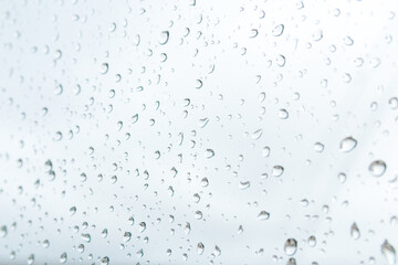 rainy weather forecast. close up raindrops on the window just before heavy rain and storm