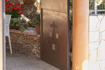 The entrance gate at the main entrance to the Deir Al-Mukhraqa Carmelite Monastery building  in northern Israel