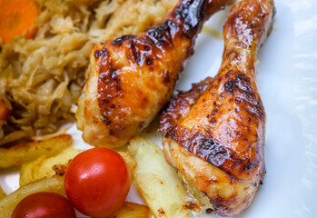 Roasted chicken legs with vegetables