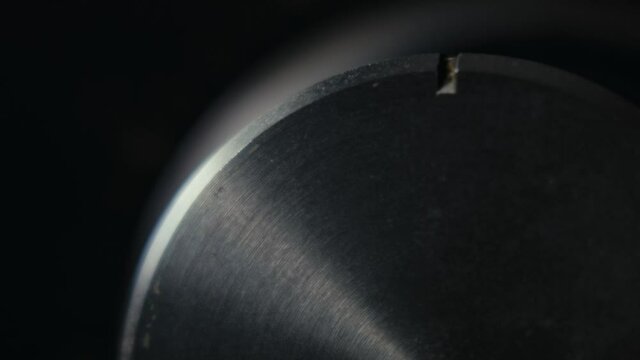 Close Up Of Turning A Shiny Volume Knob On Audio Amplifier