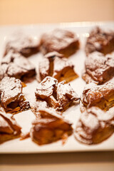 Different sort of beautiful pastry, small colorful sweet cakes on a plate. High quality photo