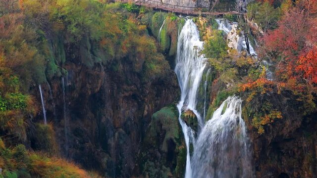 Amazing morning view of pure water waterfall in dyyp canyon. Exotic autumn scene of Plitvice National Park, Croatia, Europe. Beauty of nature concept background. Full HD video (High Definition).
