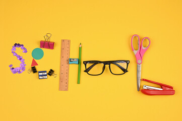 writing pad and school supplies flat lay © SYARGEENKA