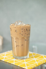 Glass of iced coffee on the table