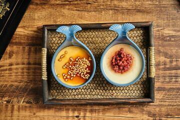 Caramelized milk red bean pudding served in a small fish-shaped bowl, top view