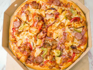 Pizza in takeaway cardboard box