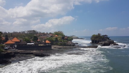 Tanah Lot temple with ocean view, sea view, water view, a rock formation off the Indonesian island of Bali Island, Indonesia