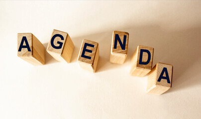 Agenda - words from wooden blocks with letters, a list of matters agenda concept, white background