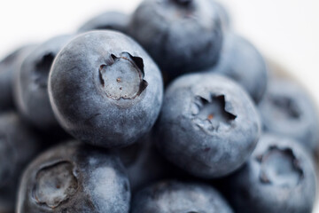 Fresh blueberry close-up isolated on a white background. Shallow depth of field. Healthy and dietary food concept. Fresh berries.