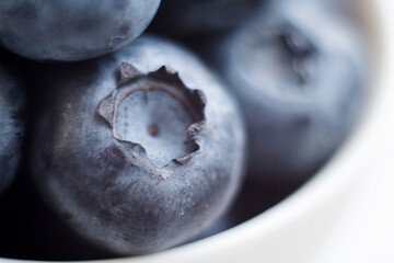 Fresh blueberry close-up isolated on a white background. Shallow depth of field. Healthy and dietary food concept. Fresh berries.