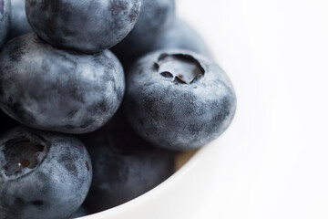 Fresh blueberry close-up isolated on a white background. Shallow depth of field. Healthy and dietary food concept. Fresh berries.