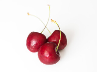 Ripe cherry on a white background, close-up.