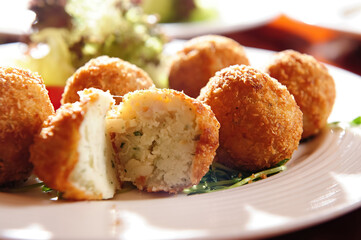 A Plate Of Fried Potato Balls