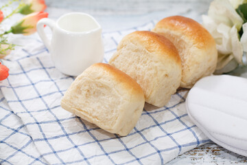 Fresh home made bread on white table background with napkin