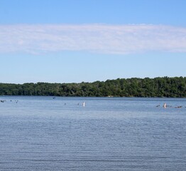Obraz premium The calm lake on a bright sunny morning.